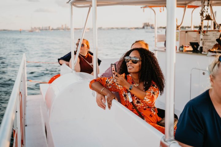 a group of people on a boat in the water