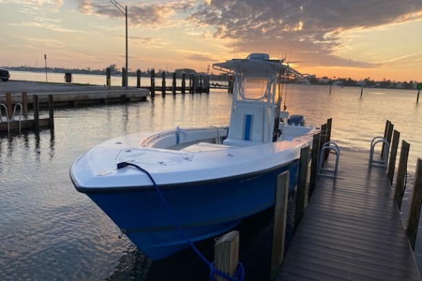 a boat is docked next to a body of water